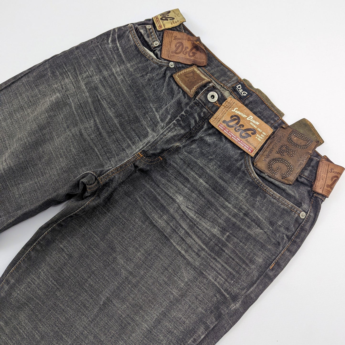 Jeans with multiple labels indicated "DG"
