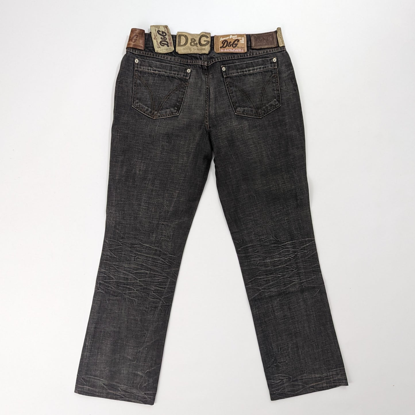 Jeans with multiple labels indicated "DG"