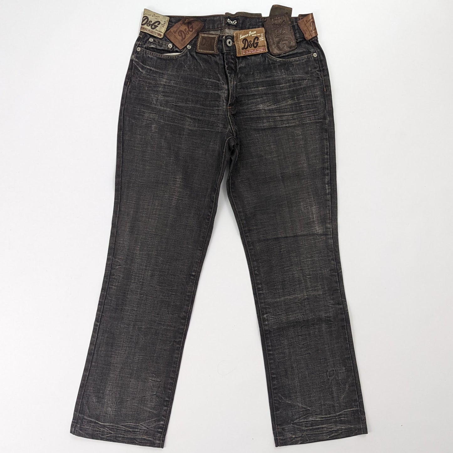 Jeans with multiple labels indicated "DG"